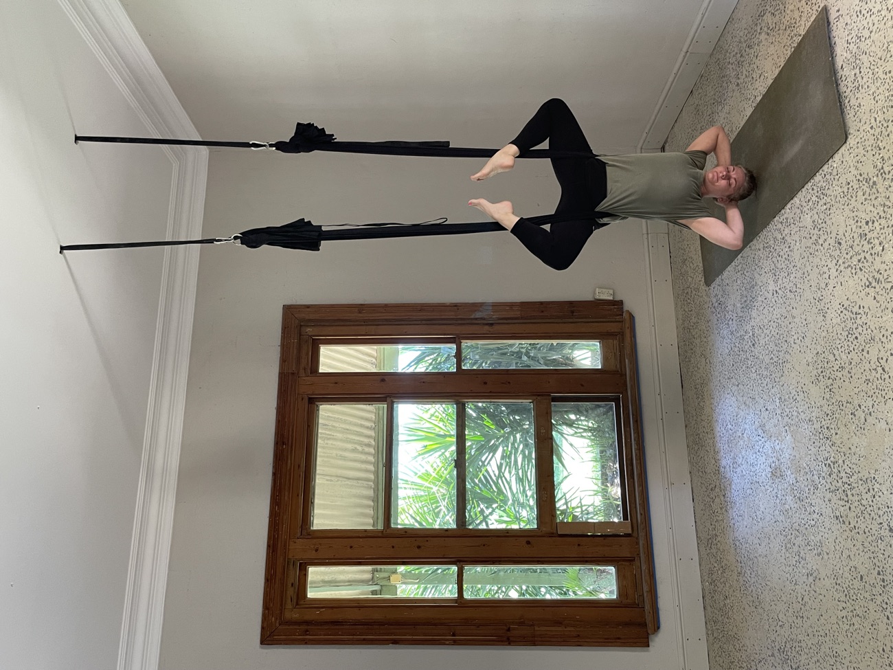 Supported aerial headstand using silk hammock straps
